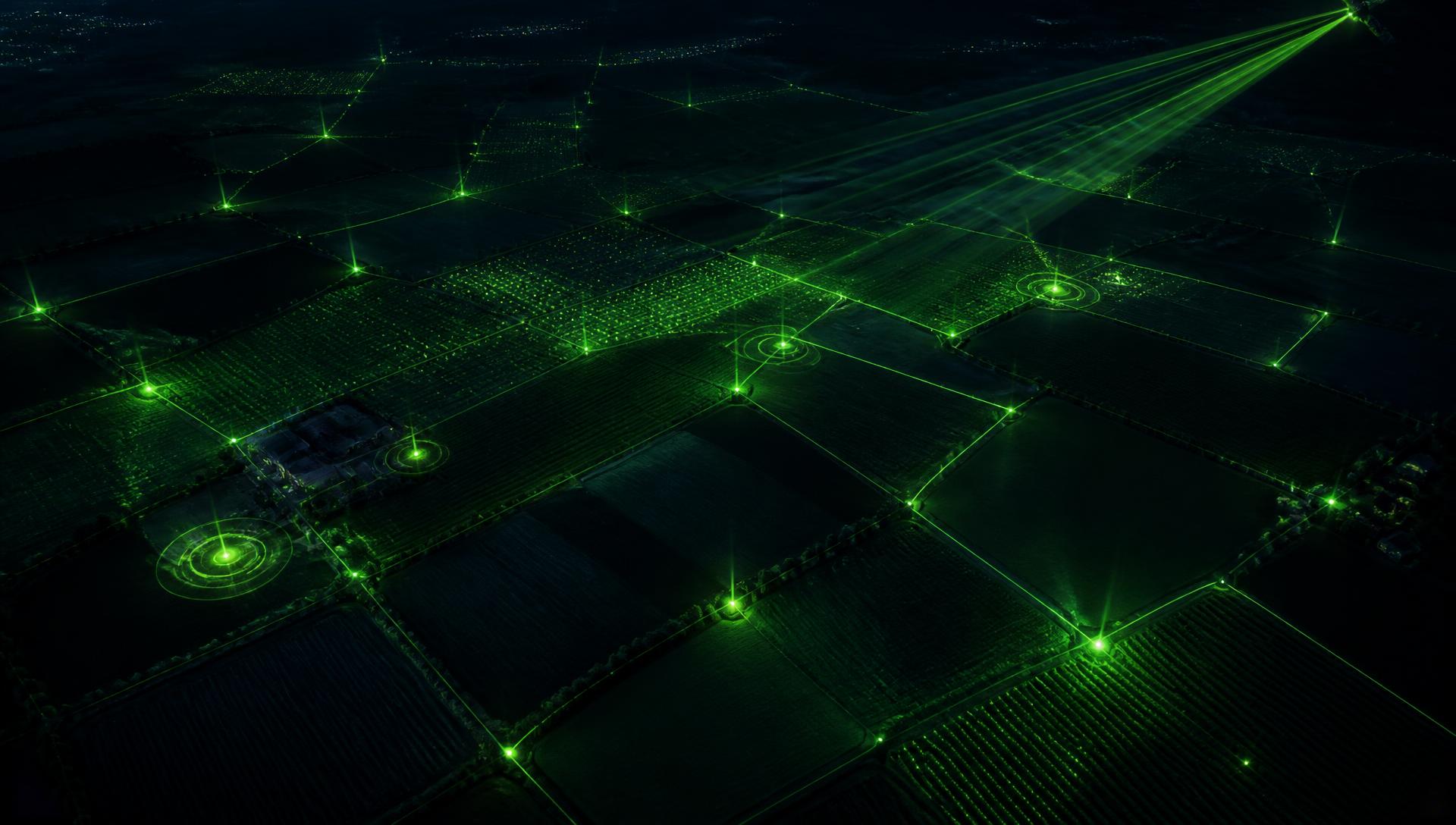 Night aerial view of crop fields with a data mesh and connected sensors